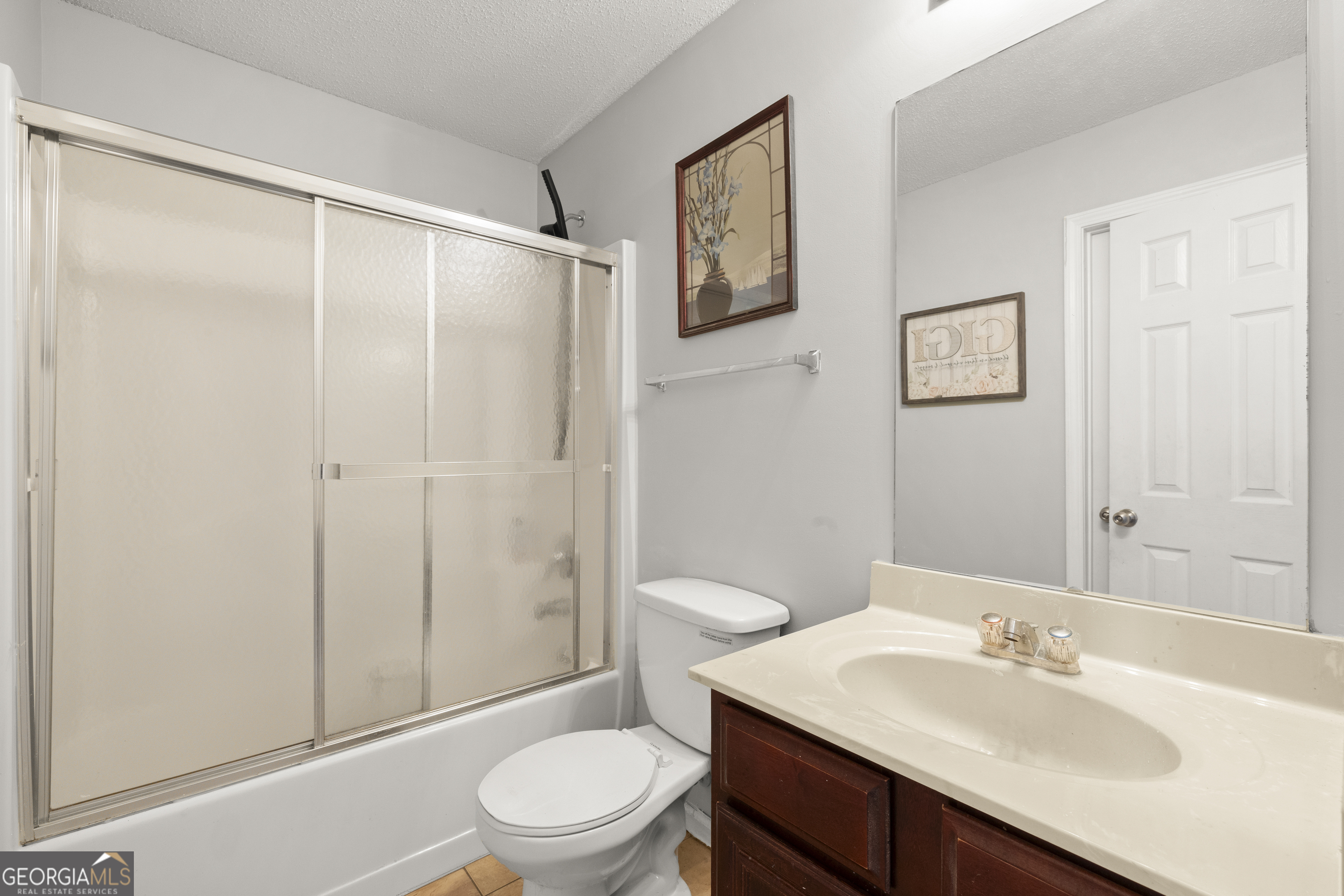 11961 Markham Way Hampton, GA 30228 - Photo 43 of 49 a bathroom with a sink toilet and shower