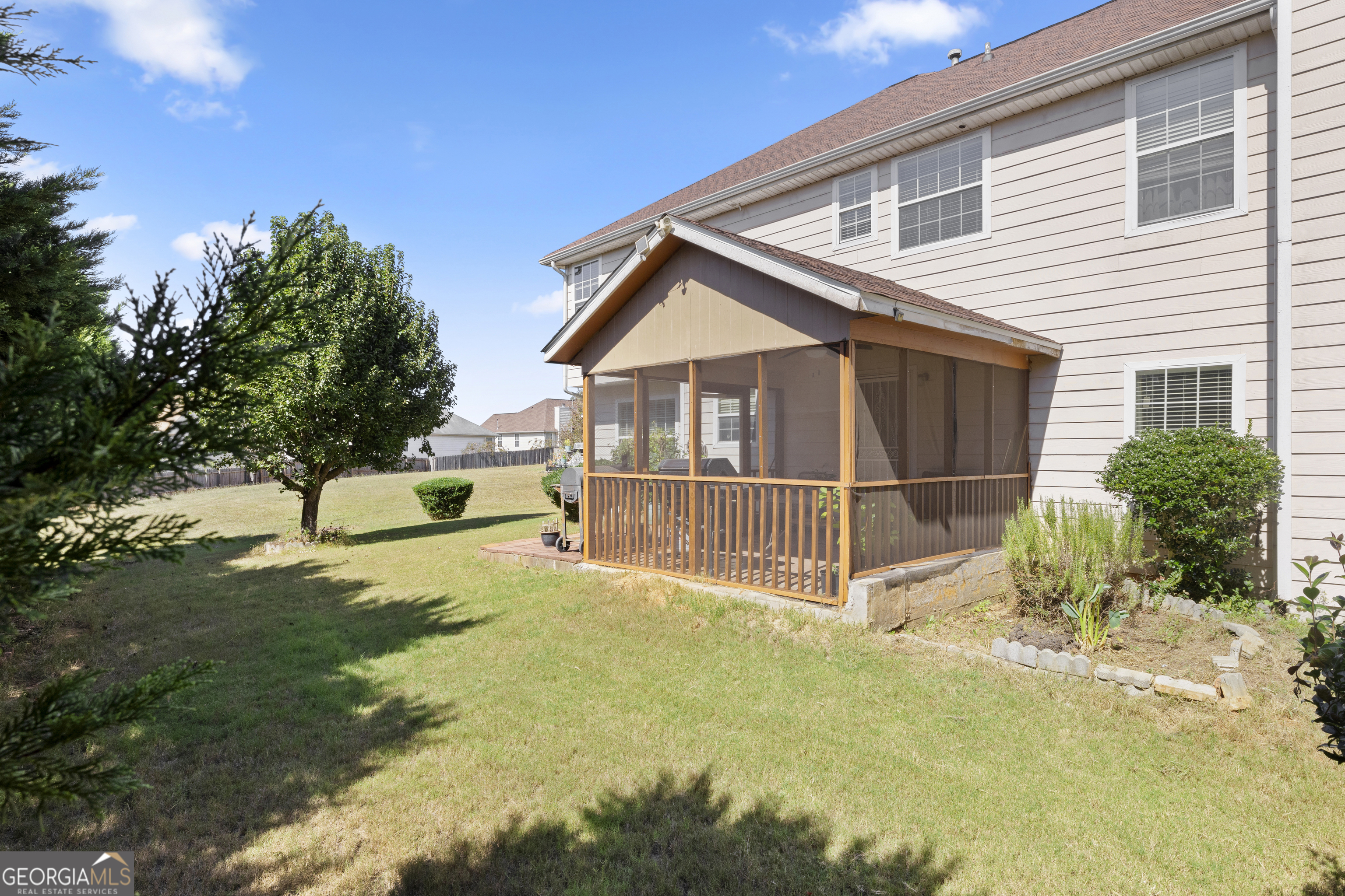 11961 Markham Way Hampton, GA 30228 - Photo 47 of 49 a view of a house with backyard and sitting area