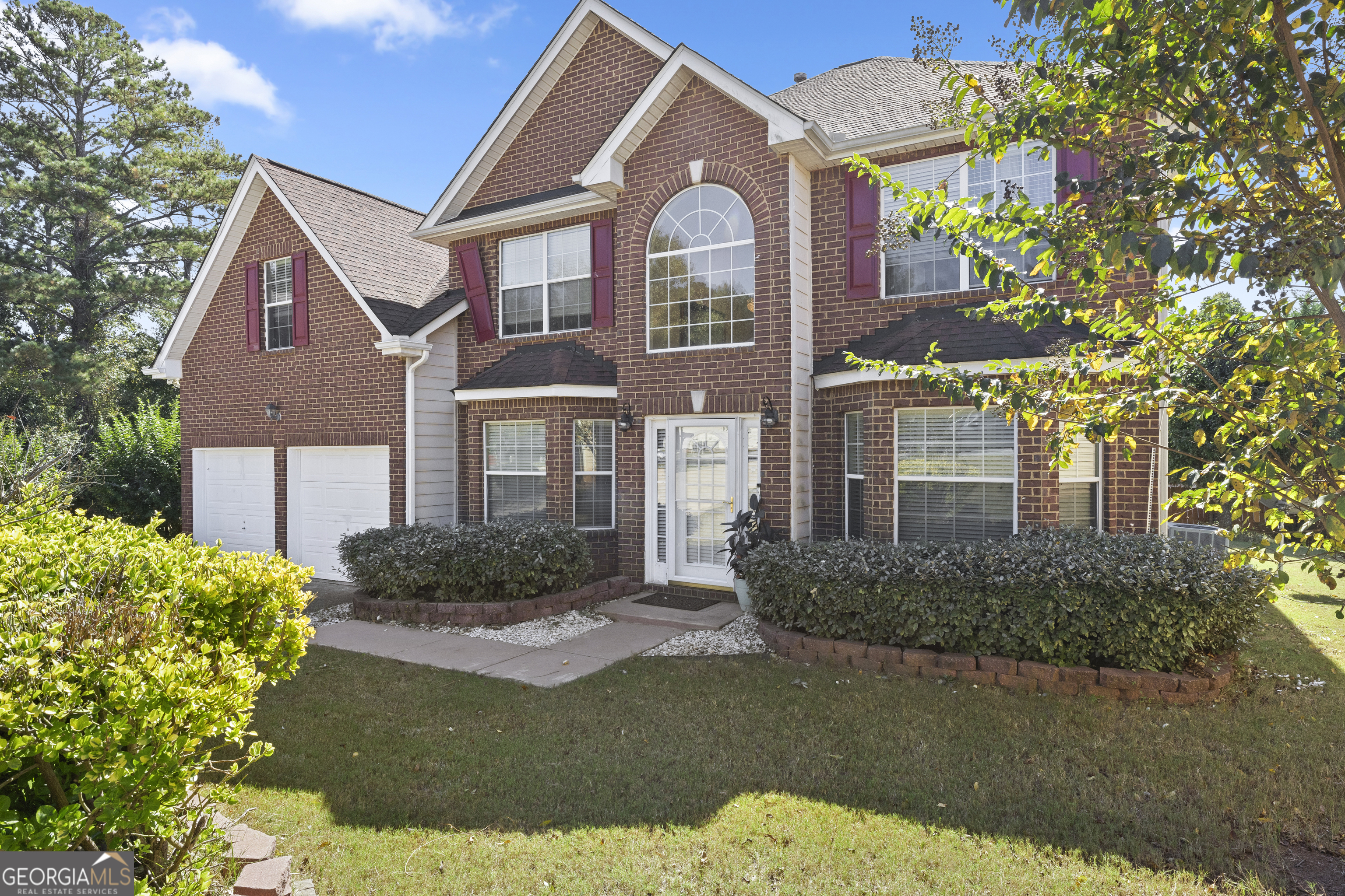 11961 Markham Way Hampton, GA 30228 - Photo 49 of 49 a front view of a house with garden