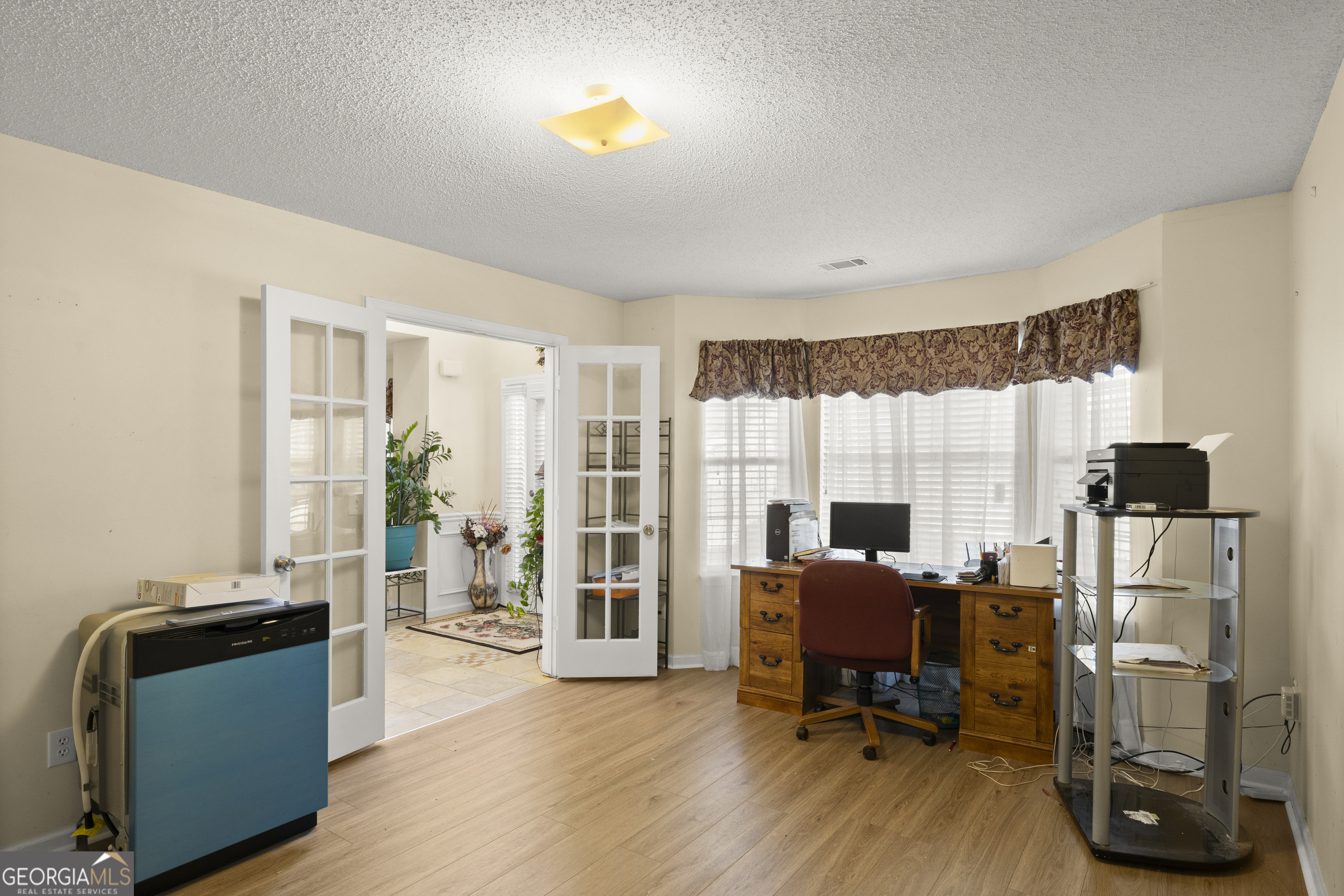11961 Markham Way Hampton, GA 30228 - Photo 6 of 49 a view of a livingroom with workspace and a window