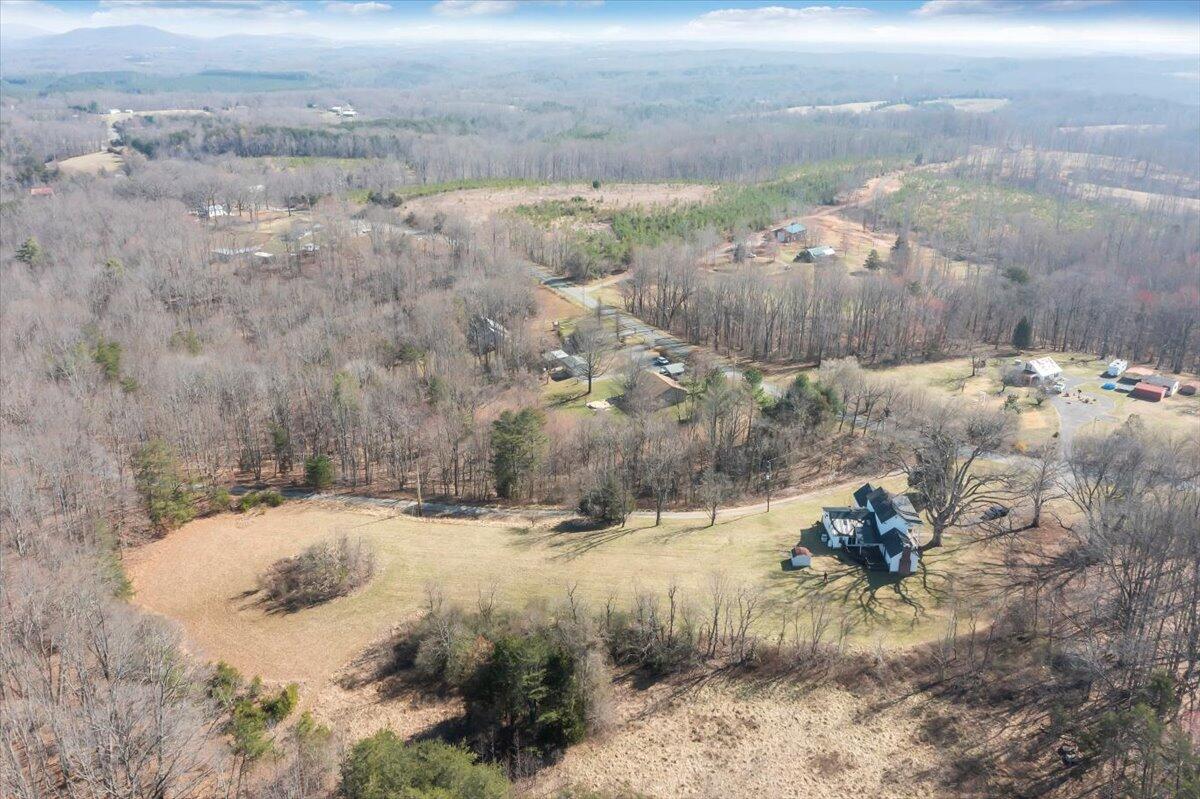 1391 Deep Woods Road Hardy, VA 24101 - Photo 15 of 43 a view of a yard with snow on the road