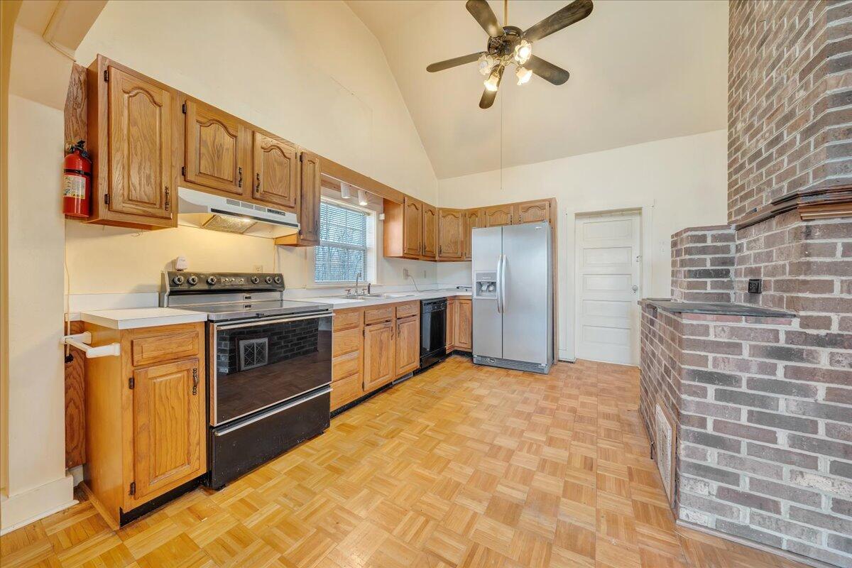1391 Deep Woods Road Hardy, VA 24101 - Photo 26 of 43 a kitchen with stainless steel appliances a stove a sink dishwasher and cabinets