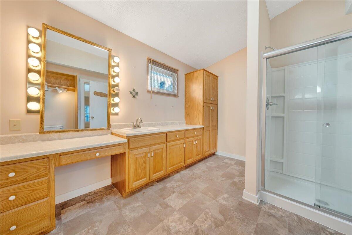 1391 Deep Woods Road Hardy, VA 24101 - Photo 31 of 43 a spacious bathroom with a granite countertop sink mirror and a