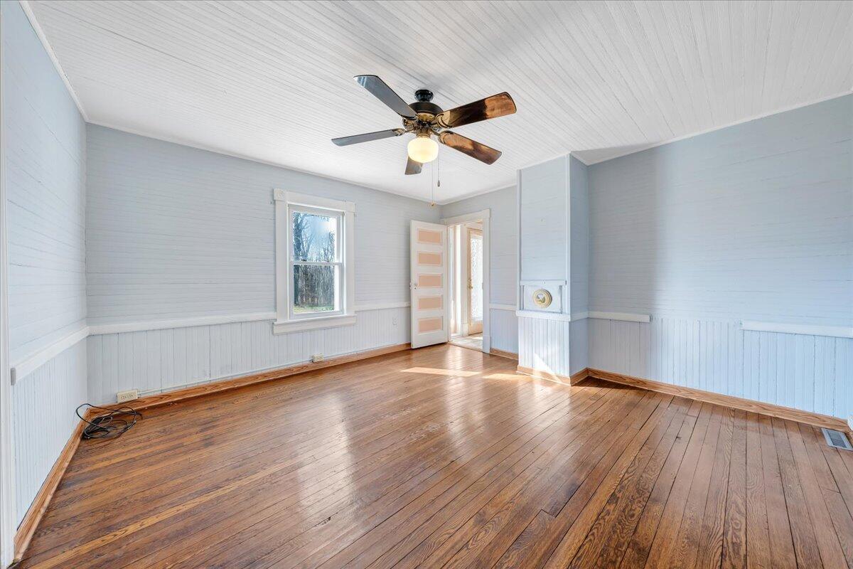 1391 Deep Woods Road Hardy, VA 24101 - Photo 35 of 43 a view of an empty room with window and wooden floor