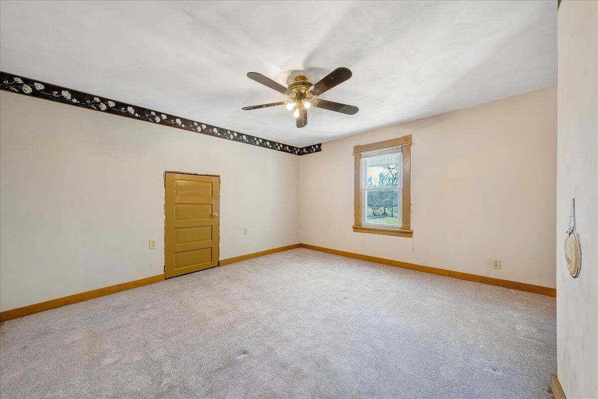 1391 Deep Woods Road Hardy, VA 24101 - Photo 39 of 43 an empty room with windows and fan