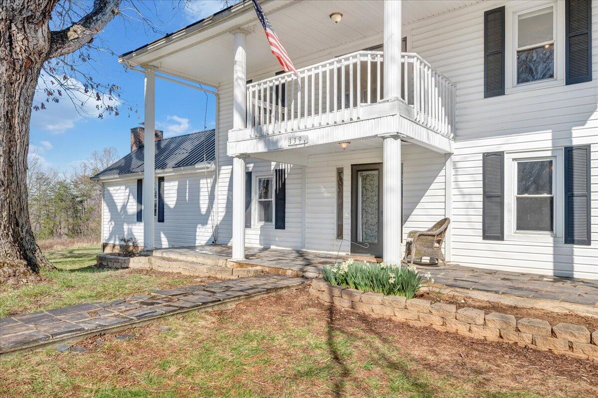 1391 Deep Woods Road Hardy, VA 24101 - Photo 5 of 43 a front view of a house with a yard