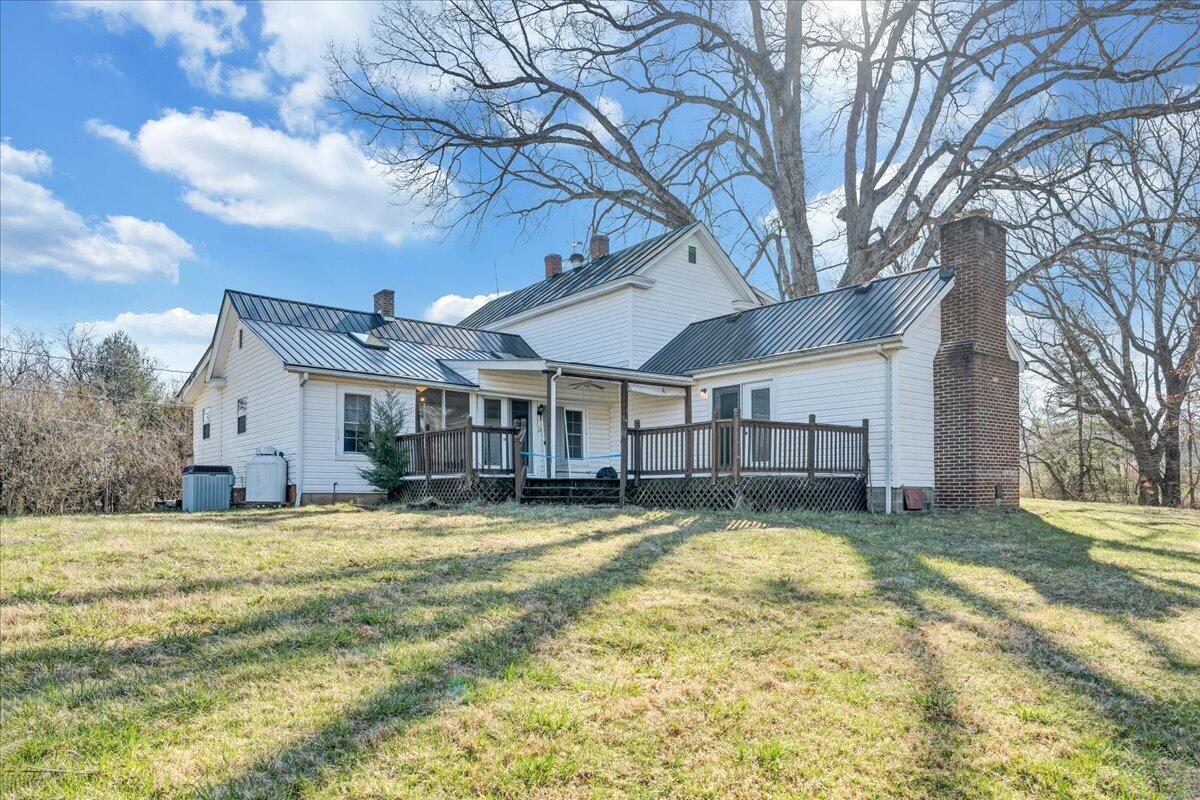 1391 Deep Woods Road Hardy, VA 24101 - Photo 9 of 43 a view of a house with a yard and large trees