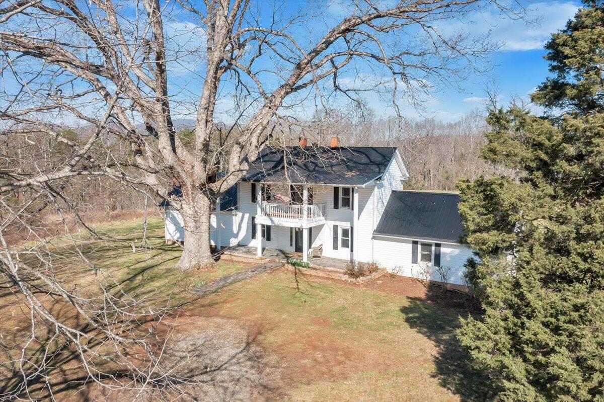1391 Deep Woods Road Hardy, VA 24101 - Photo 10 of 43 a house with trees in front of it