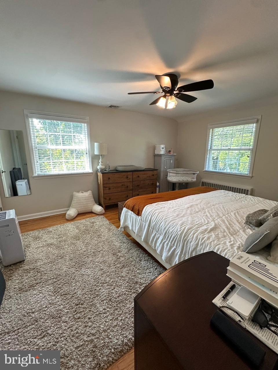 227 Dorset Road Devon, PA 19333 - Photo 18 of 30 a bedroom with two beds and a chandelier