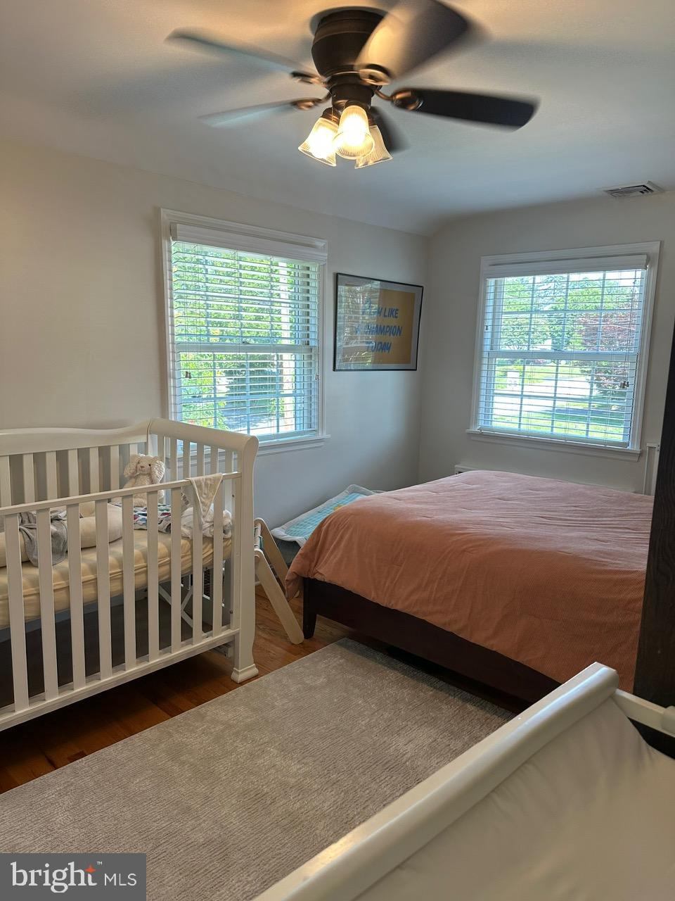 227 Dorset Road Devon, PA 19333 - Photo 20 of 30 a bedroom with a bed and a chandelier