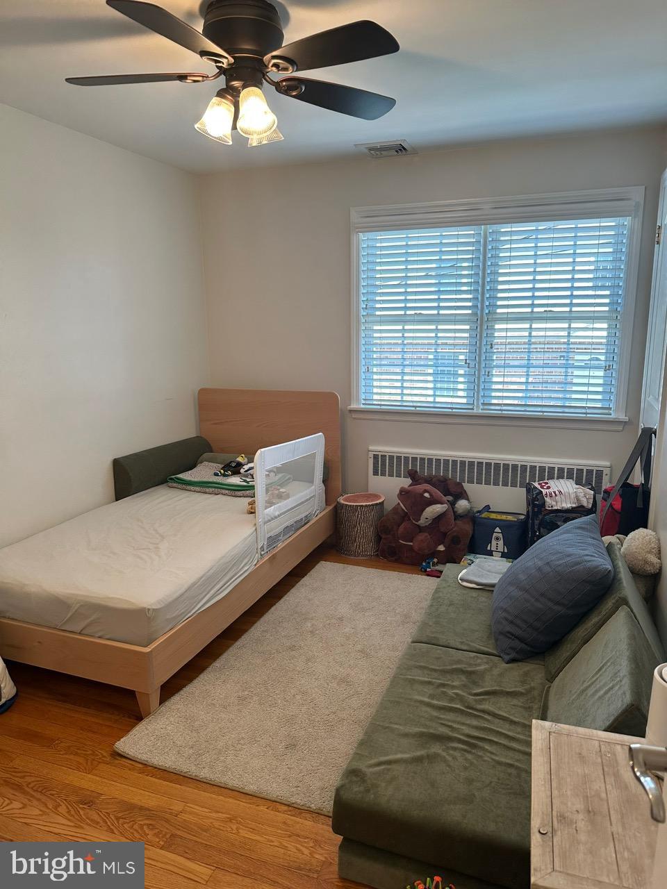 227 Dorset Road Devon, PA 19333 - Photo 21 of 30 a bed room with a bed and a couch