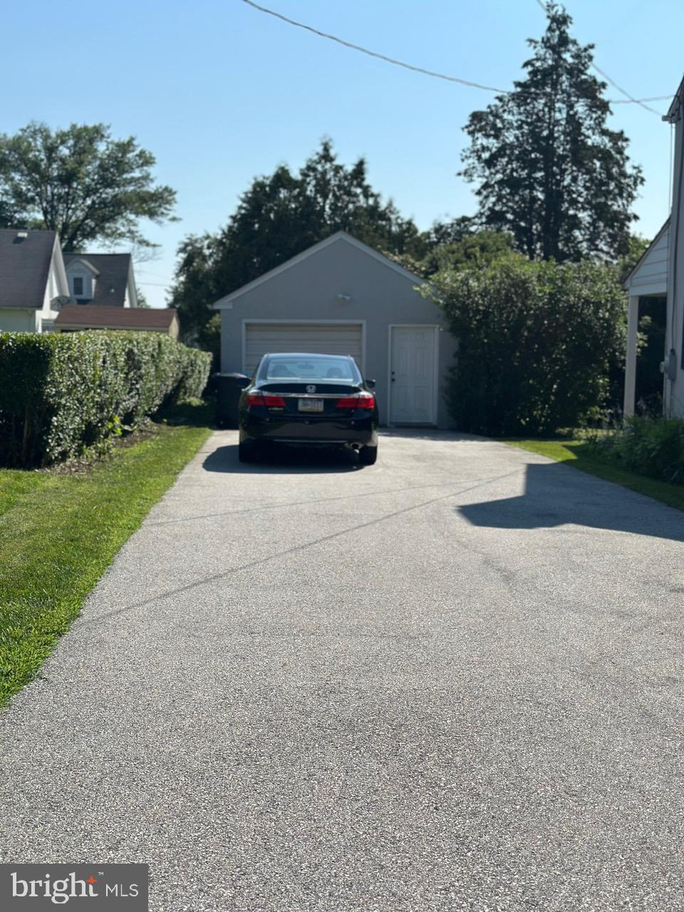 227 Dorset Road Devon, PA 19333 - Photo 4 of 30 a car parked in front of house with a yard