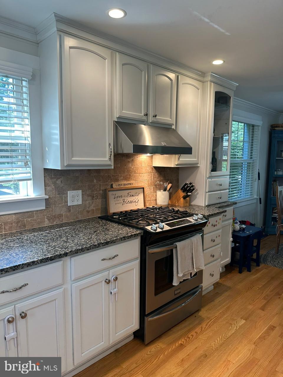 227 Dorset Road Devon, PA 19333 - Photo 6 of 30 a kitchen with stainless steel appliances granite countertop a stove a sink and a granite counter tops