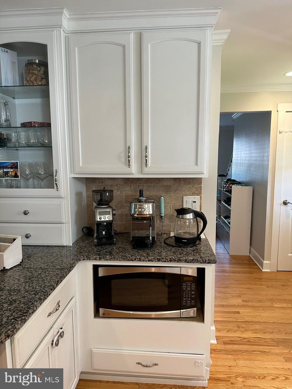 227 Dorset Road Devon, PA 19333 - Photo 8 of 30 a kitchen with granite countertop stainless steel appliances a stove a sink and a counter space