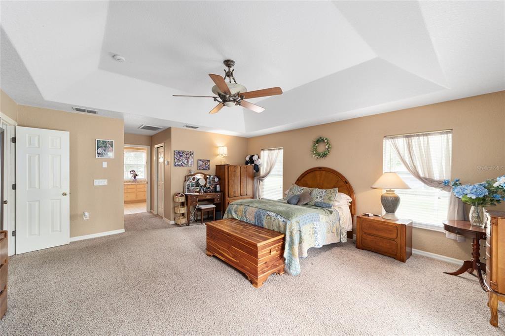 2151 Southeast 59th Street Ocala, FL 34480 - Photo 23 of 72 a bed room with a bed and a ceiling fan