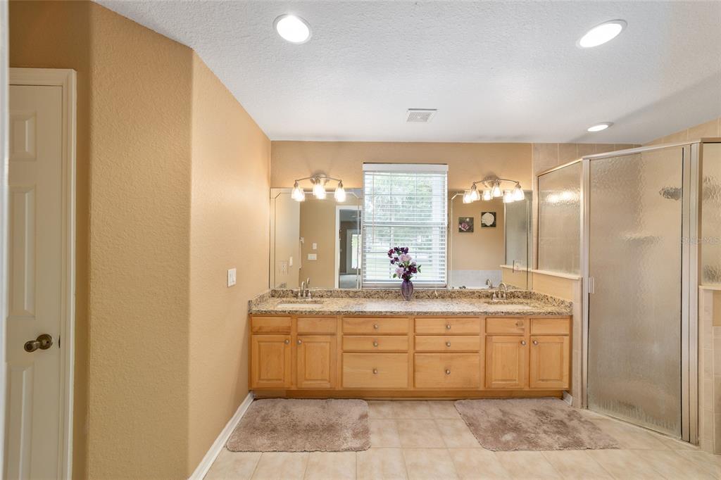 2151 Southeast 59th Street Ocala, FL 34480 - Photo 24 of 72 a bathroom with a double vanity sink and a mirror