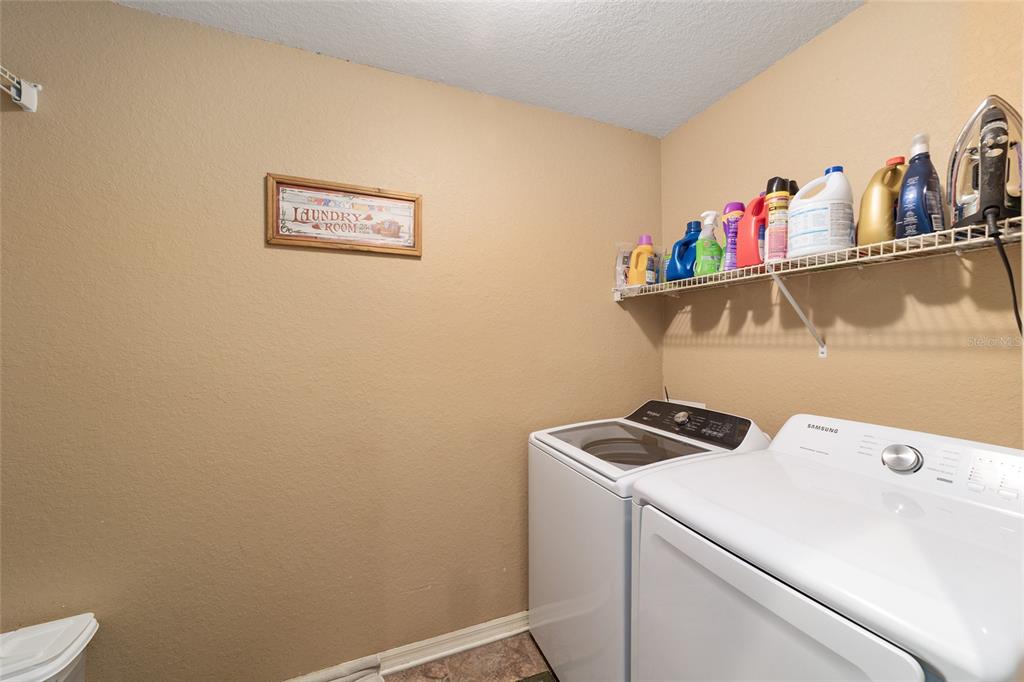 2151 Southeast 59th Street Ocala, FL 34480 - Photo 43 of 72 a utility room with dryer and washer