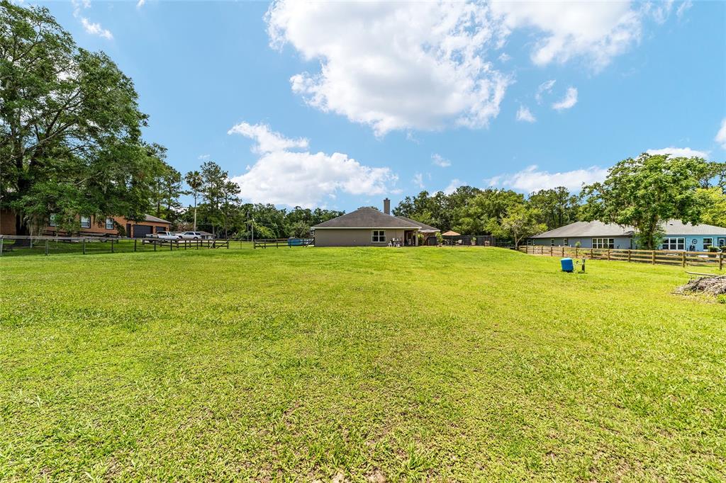 2151 Southeast 59th Street Ocala, FL 34480 - Photo 55 of 72 a view of a swimming pool with an outdoor space and seating area