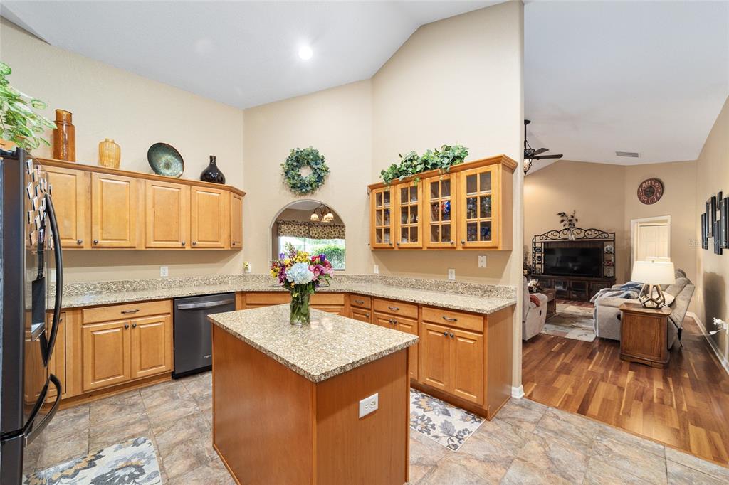 2151 Southeast 59th Street Ocala, FL 34480 - Photo 66 of 72 a kitchen with a sink stove and cabinets