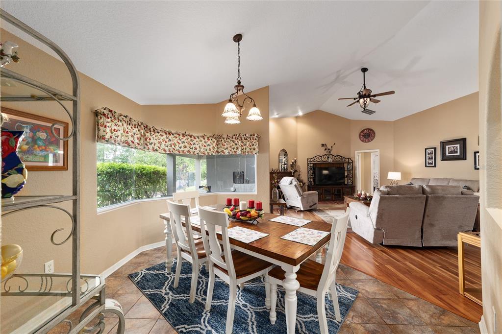 2151 Southeast 59th Street Ocala, FL 34480 - Photo 67 of 72 a view of a dining room with furniture window and wooden floor