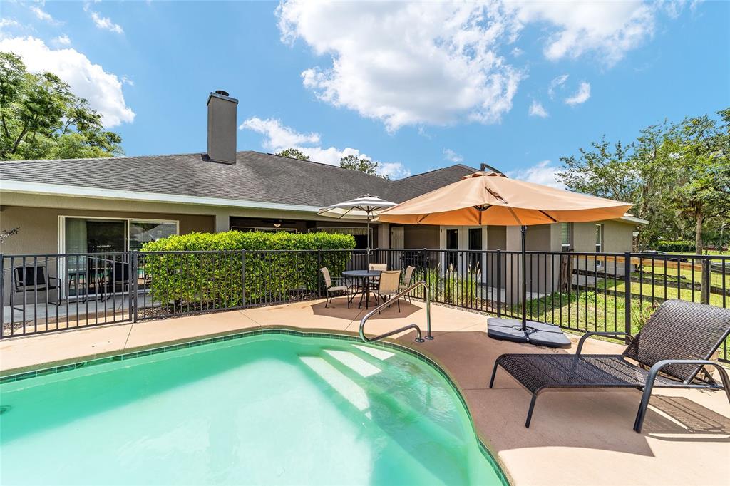 2151 Southeast 59th Street Ocala, FL 34480 - Photo 10 of 72 a view of a house with backyard sitting area and garden