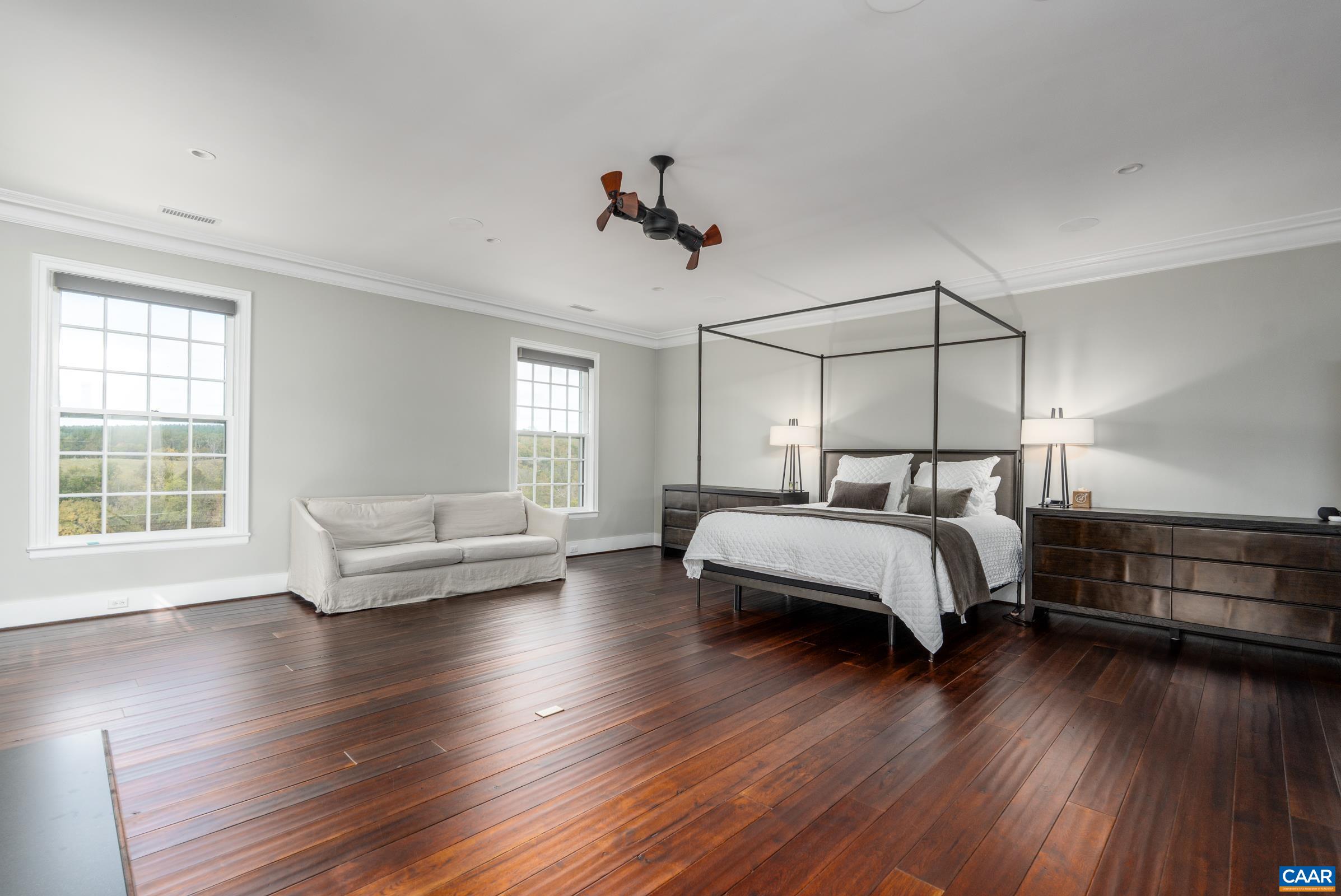 1859 Rivanna Farm Charlottesville, VA 22911 - Photo 13 of 45 a bedroom with a bed and wooden floor