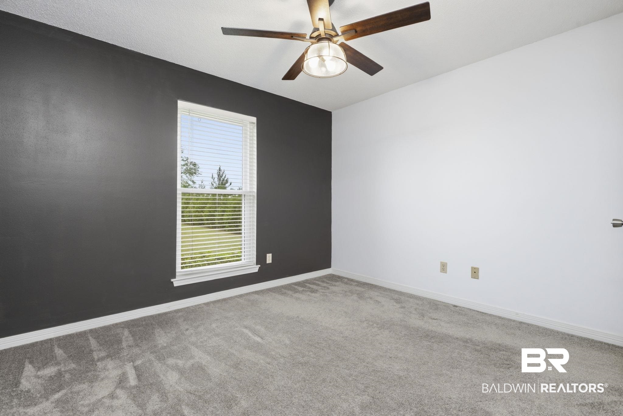 10670 Jeff Hamilton Road Mobile, AL 36695 - Photo 25 of 43 Empty room featuring light carpet and a ceiling fan