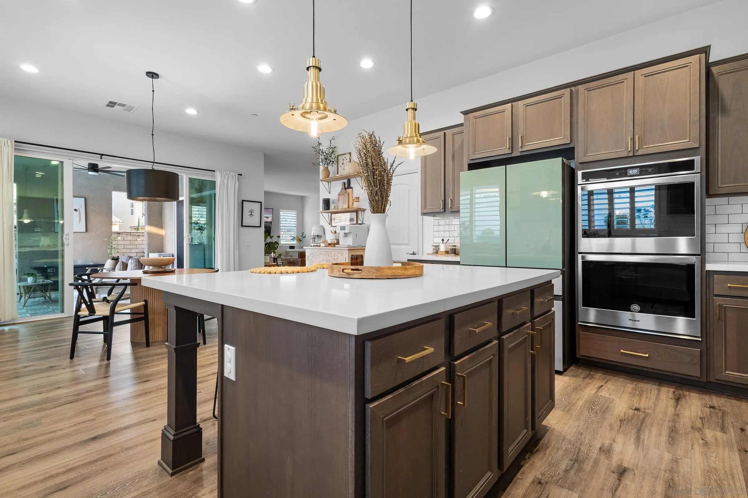 1853 Ashley Avenue Chula Vista, CA 91913 - Photo 14 of 73 a kitchen with kitchen island wooden cabinets and stainless steel appliances