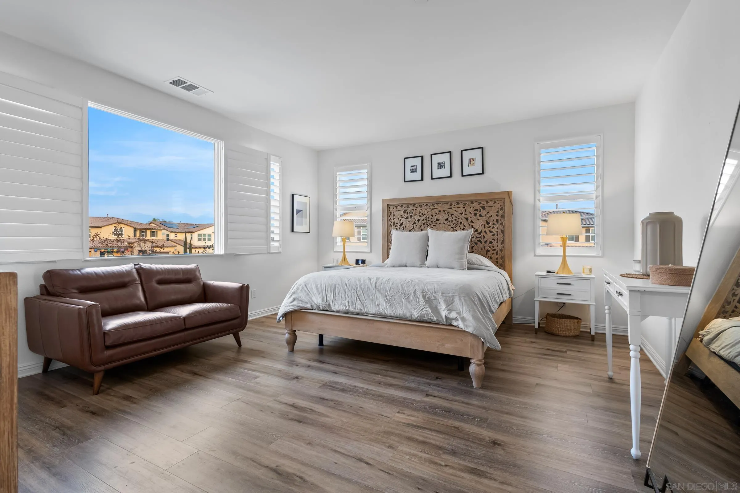 1853 Ashley Avenue Chula Vista, CA 91913 - Photo 28 of 73 a bedroom with a bed and a couch