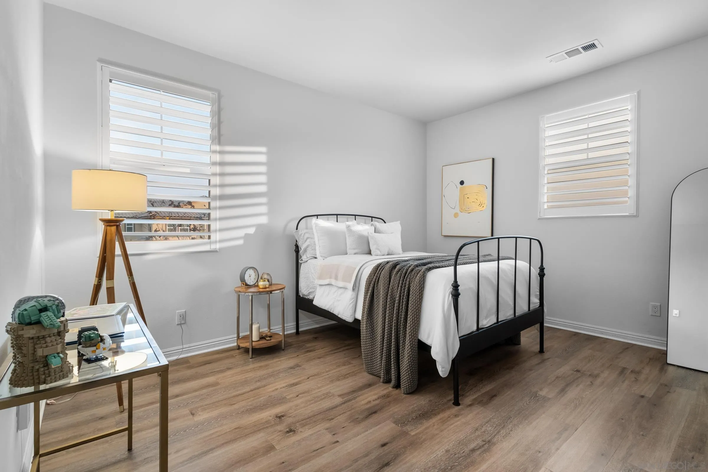 1853 Ashley Avenue Chula Vista, CA 91913 - Photo 38 of 73 a bedroom with a bed and wooden floor