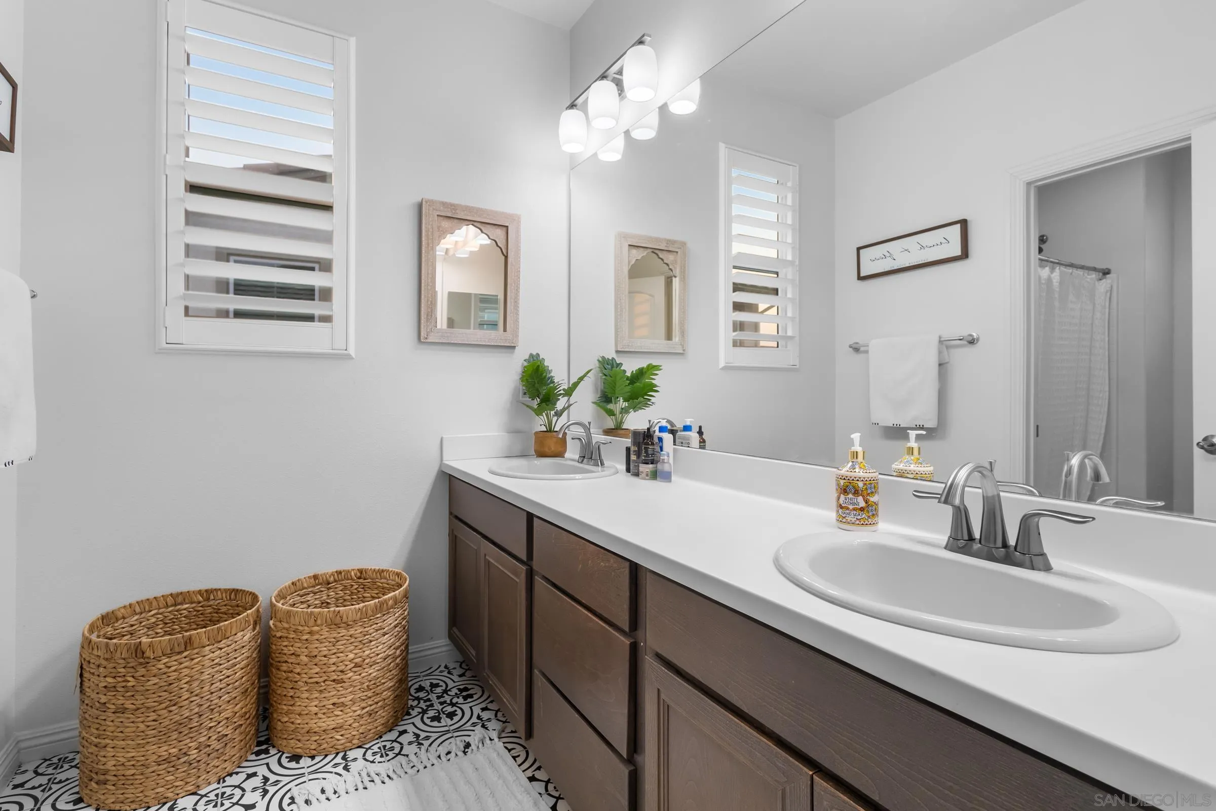 1853 Ashley Avenue Chula Vista, CA 91913 - Photo 41 of 73 a bathroom with a sink granite and a mirror