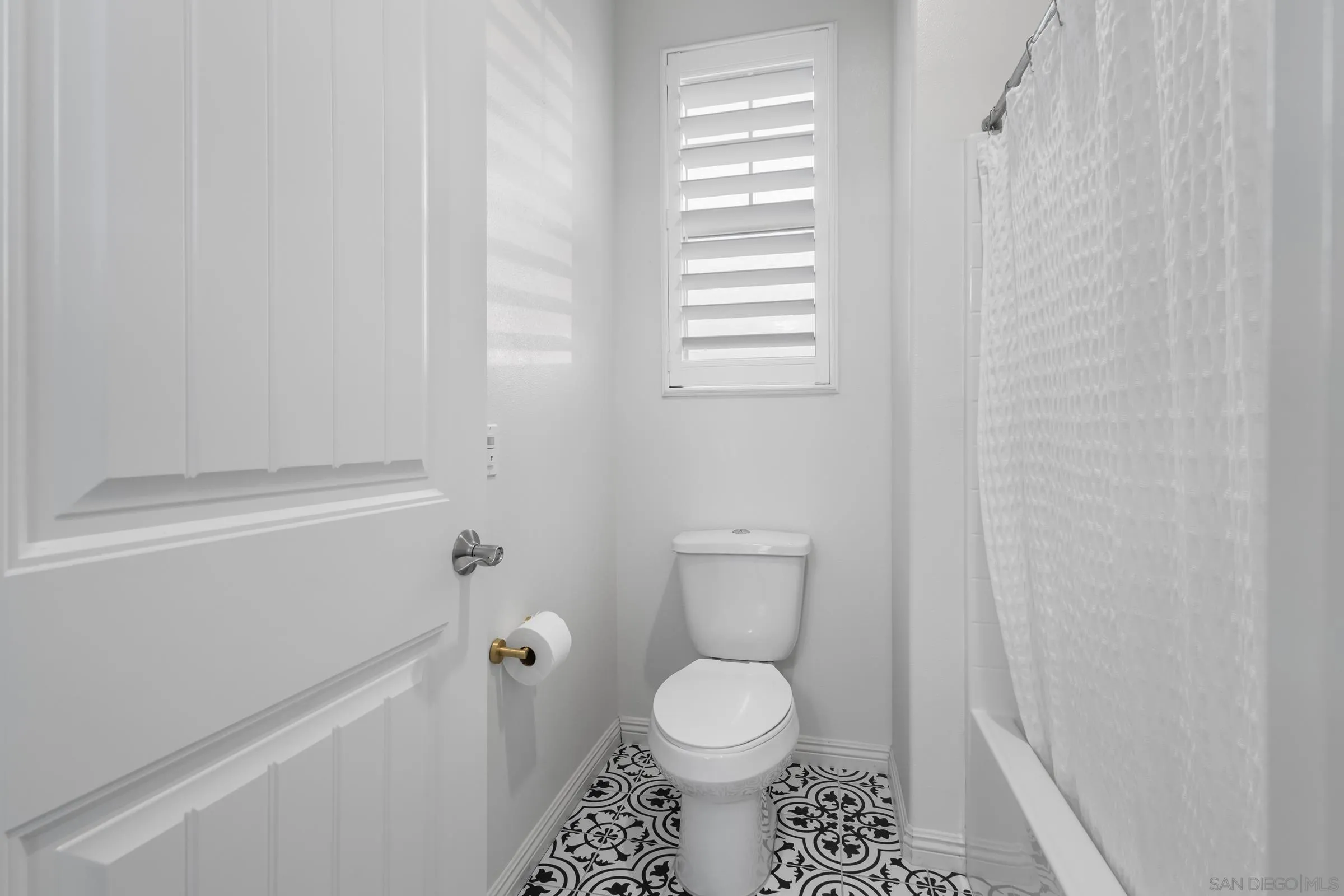 1853 Ashley Avenue Chula Vista, CA 91913 - Photo 43 of 73 a bathroom with a toilet a sink and a window