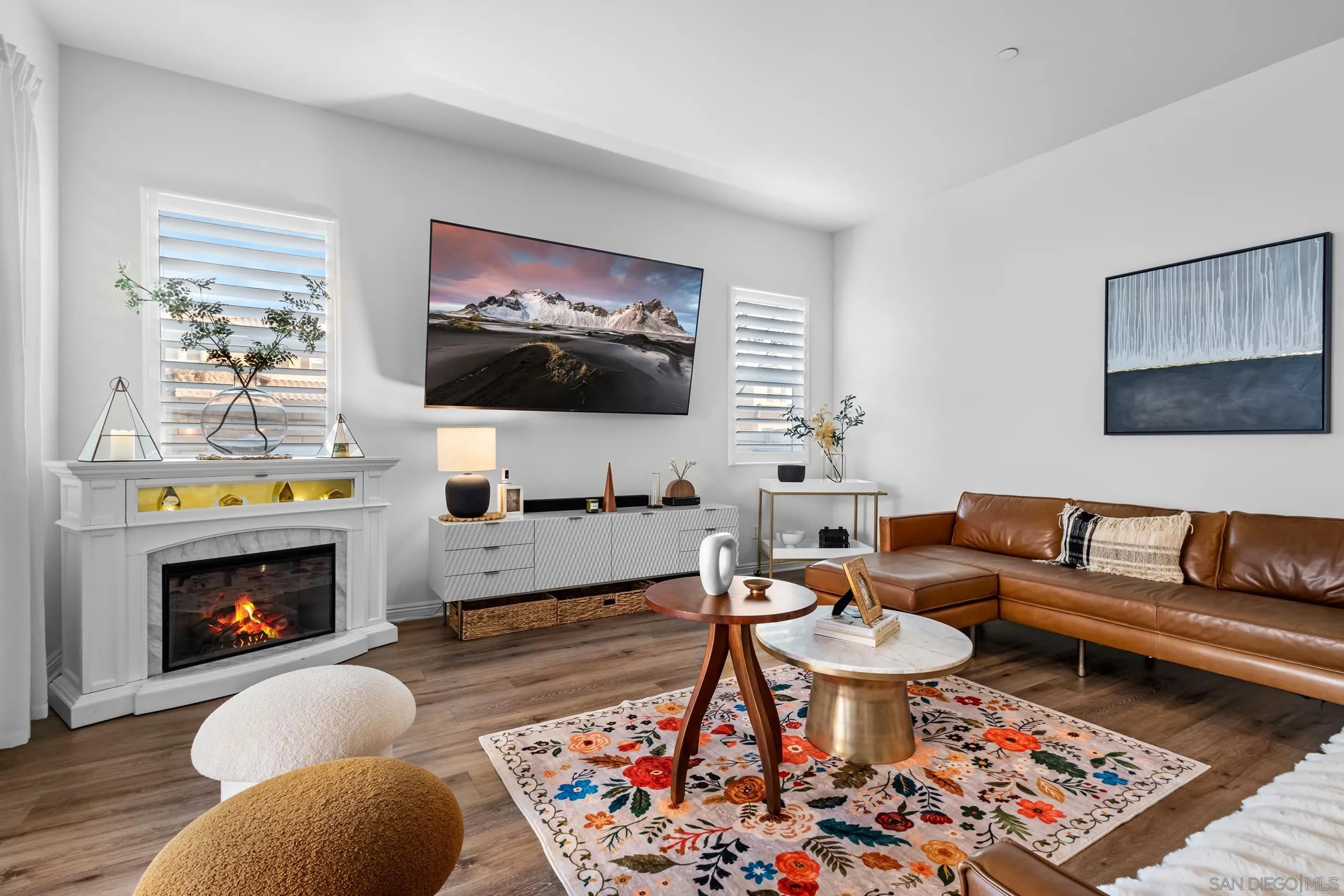 1853 Ashley Avenue Chula Vista, CA 91913 - Photo 55 of 73 a living room with furniture a flat screen tv and a fireplace