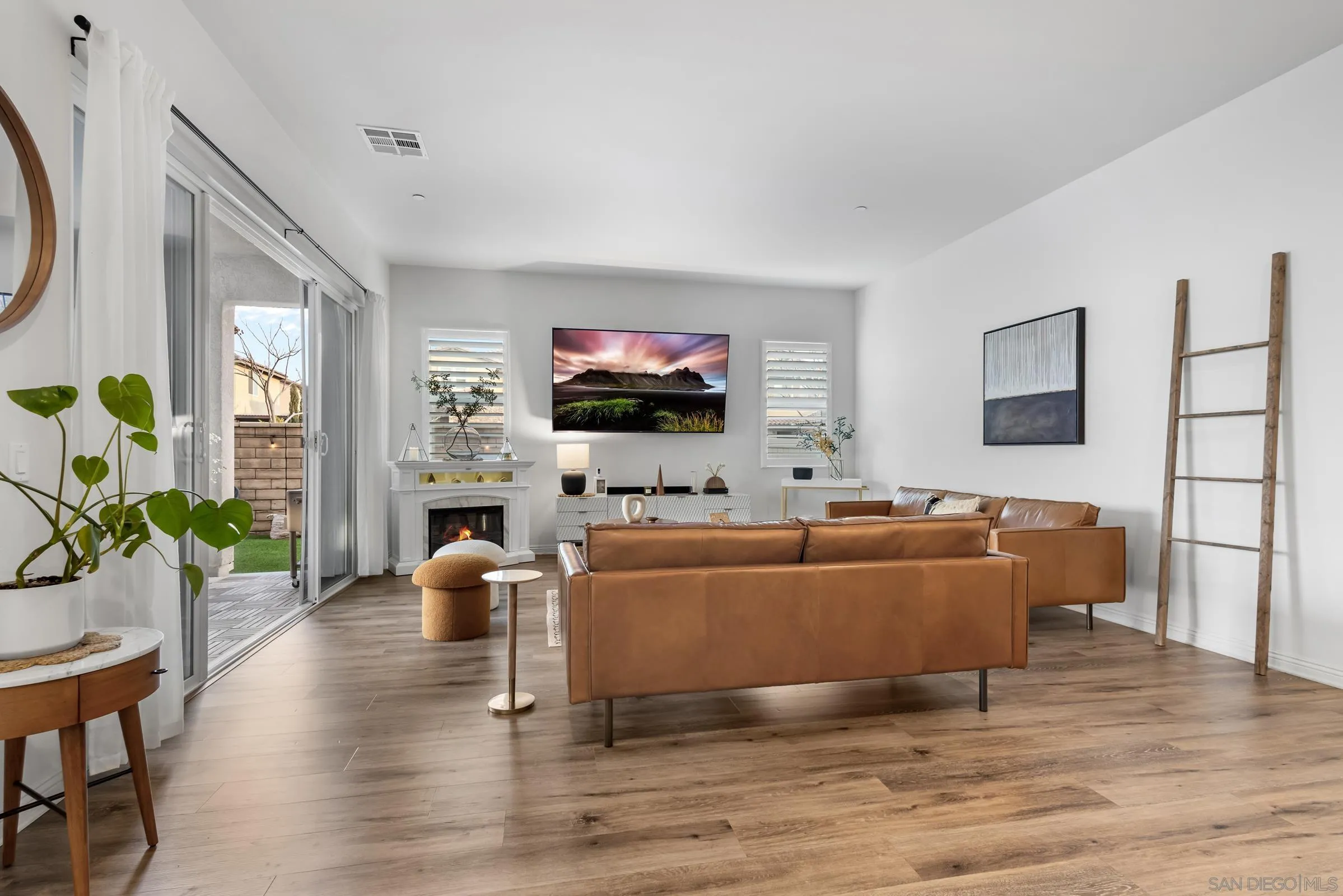 1853 Ashley Avenue Chula Vista, CA 91913 - Photo 67 of 73 a living room with furniture and a flat screen tv