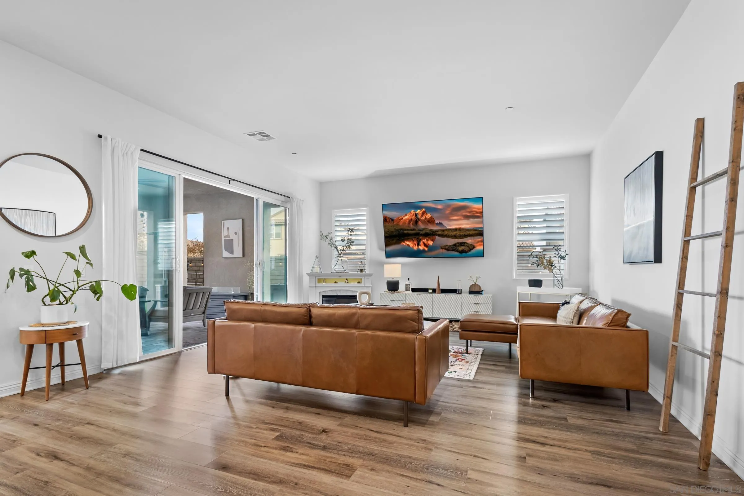 1853 Ashley Avenue Chula Vista, CA 91913 - Photo 69 of 73 a living room with furniture and a flat screen tv
