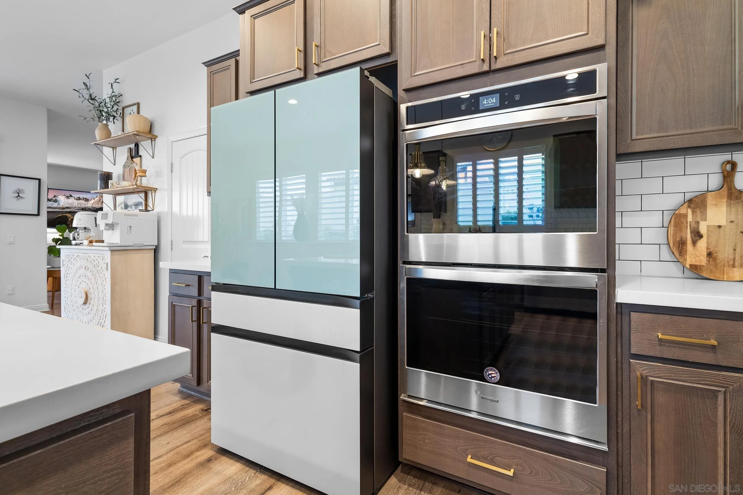1853 Ashley Avenue Chula Vista, CA 91913 - Photo 71 of 73 a kitchen with cabinets and stainless steel appliances