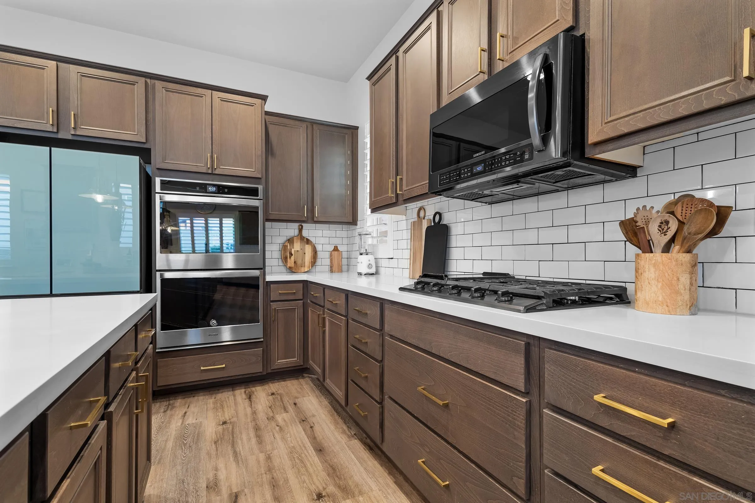 1853 Ashley Avenue Chula Vista, CA 91913 - Photo 73 of 73 a kitchen with stainless steel appliances a stove and cabinets