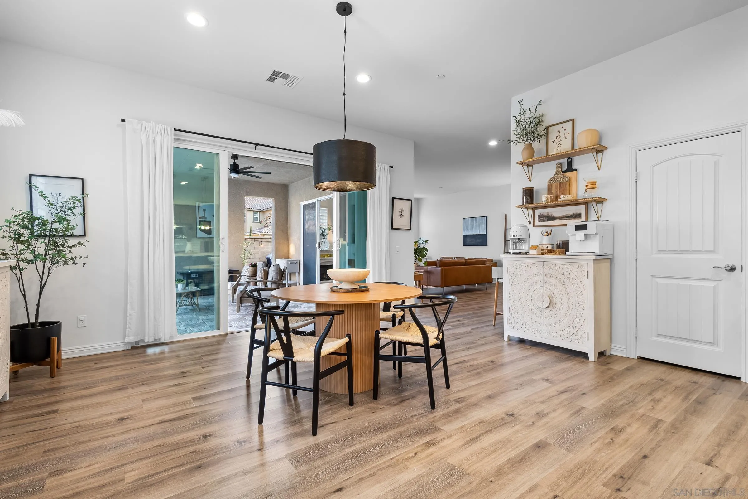 1853 Ashley Avenue Chula Vista, CA 91913 - Photo 9 of 73 a view of a dining room with furniture and wooden floor