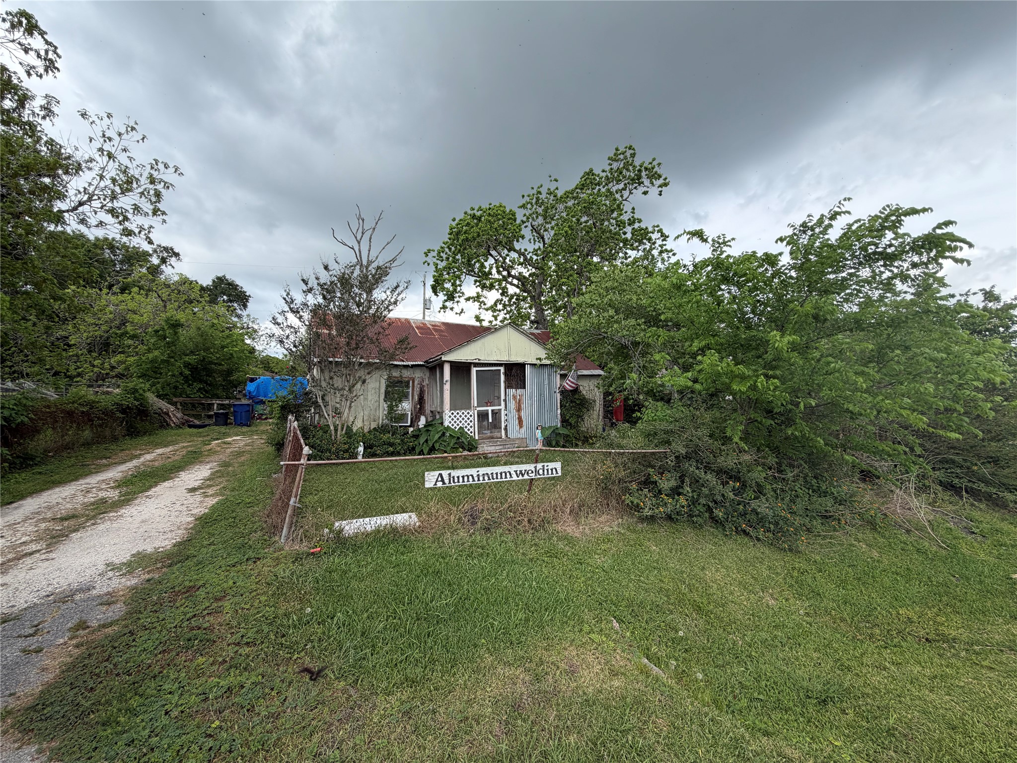 2212 Highway 288 Business Angleton, TX 77515 - Photo 5 of 7 a view of a house with a yard
