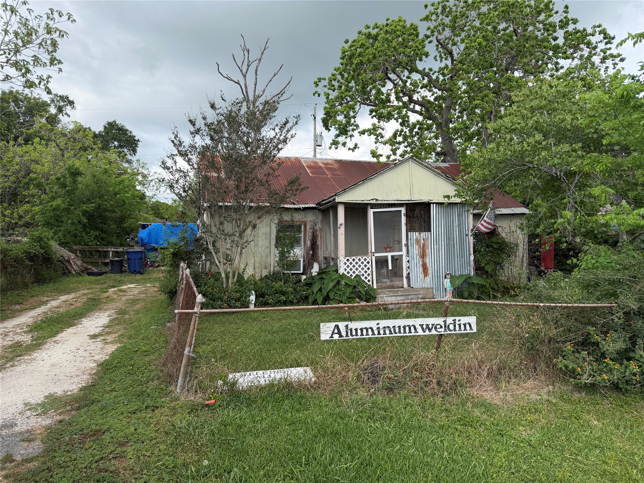 2212 Highway 288 Business Angleton, TX 77515 - Photo 6 of 7 a front view of a house with a yard