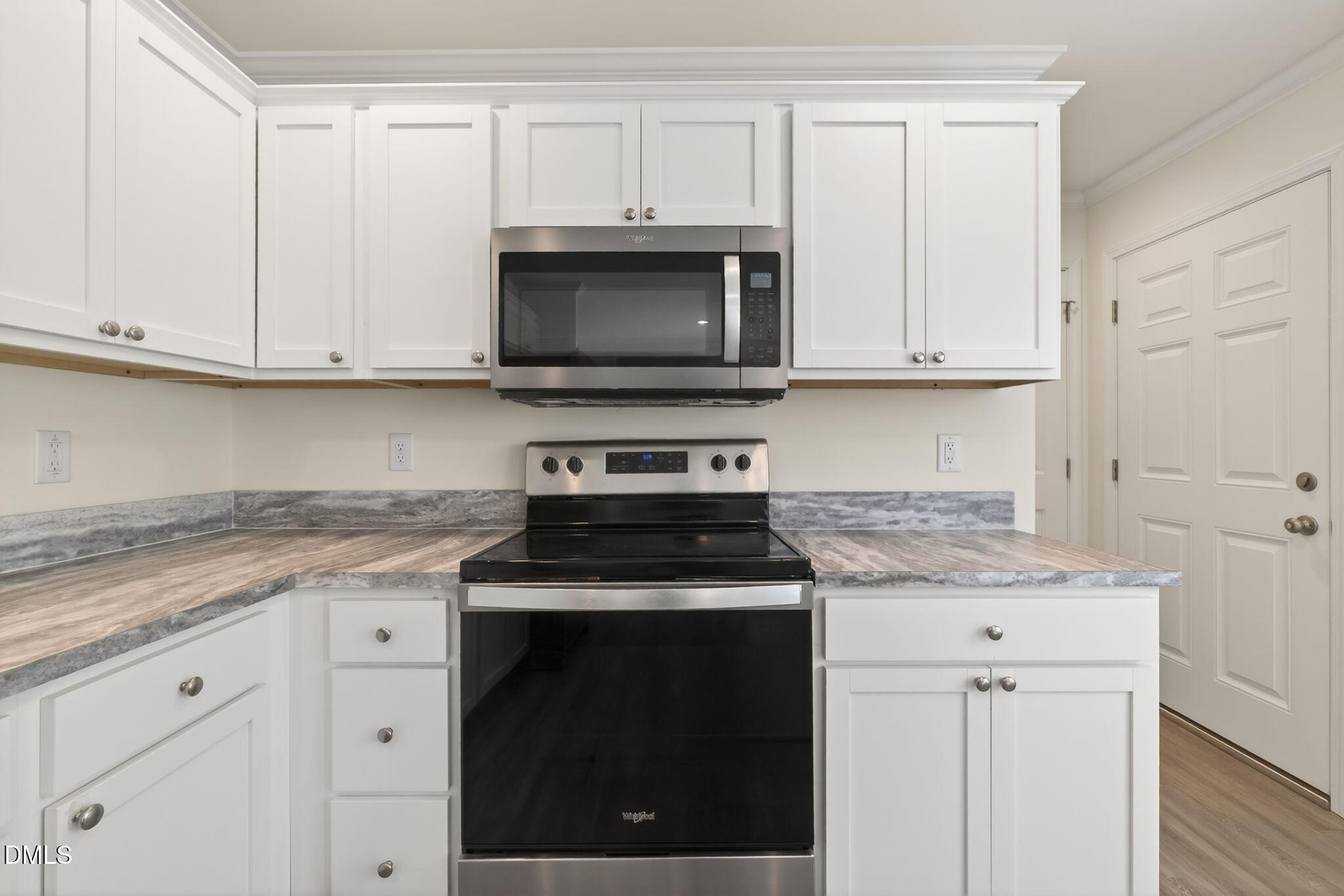 7122 Guess Road Hillsborough, NC 27278 - Photo 6 of 48 a kitchen with granite countertop white cabinets and a stove a oven with white countertops