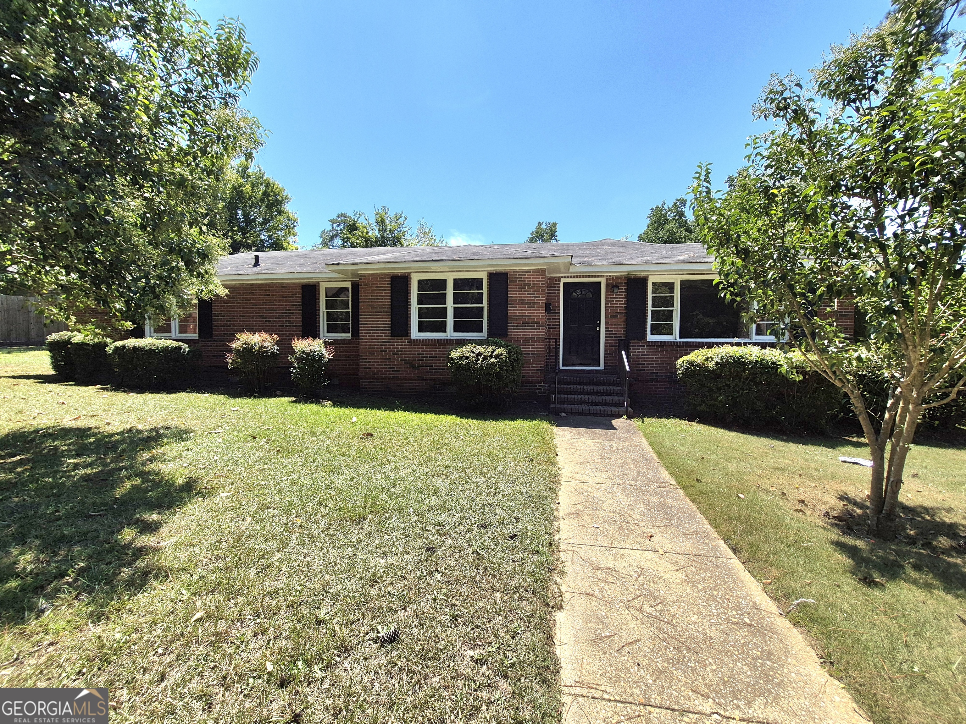1908 Garrard Street Columbus, GA 31906 - Photo 1 of 14 a front view of a house with a yard