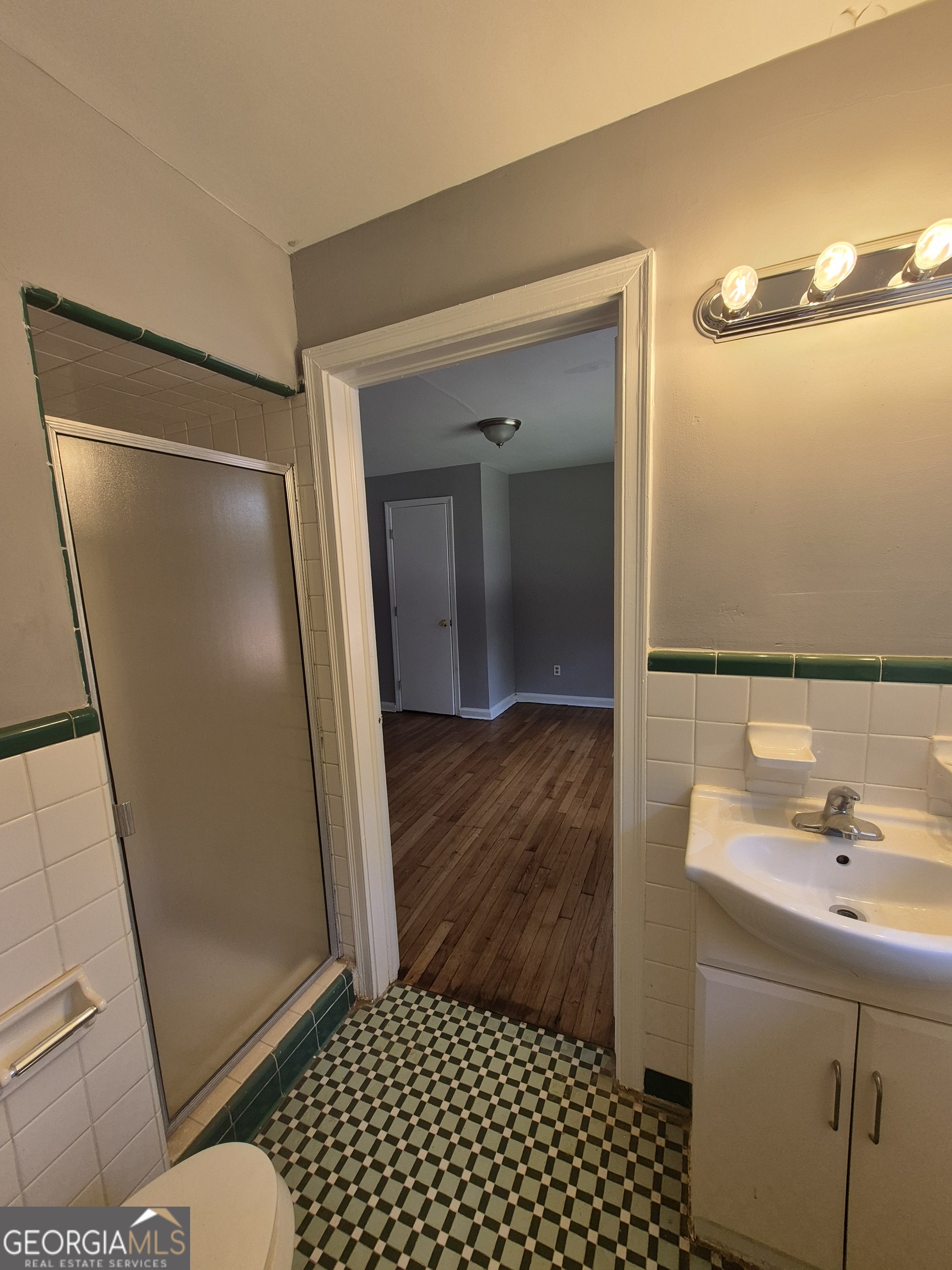 1908 Garrard Street Columbus, GA 31906 - Photo 11 of 14 a bathroom with a sink and a mirror