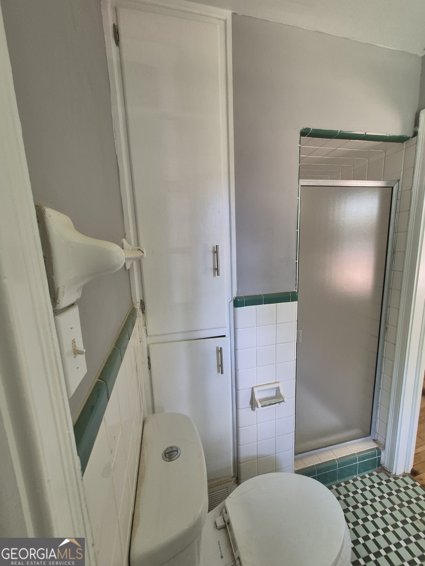 1908 Garrard Street Columbus, GA 31906 - Photo 13 of 14 a bathroom with a toilet and a shower