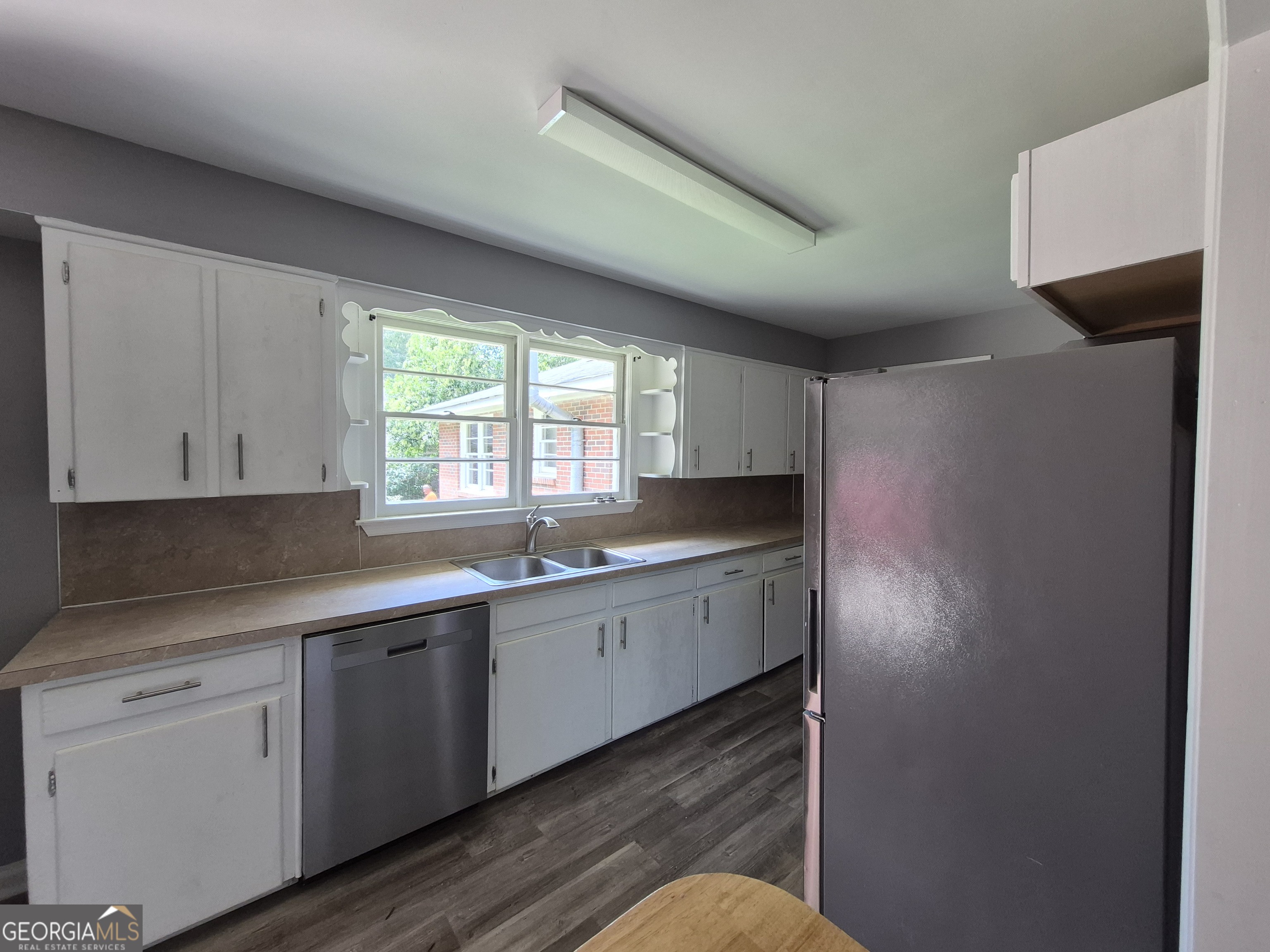 1908 Garrard Street Columbus, GA 31906 - Photo 7 of 14 a kitchen with sink cabinets and window