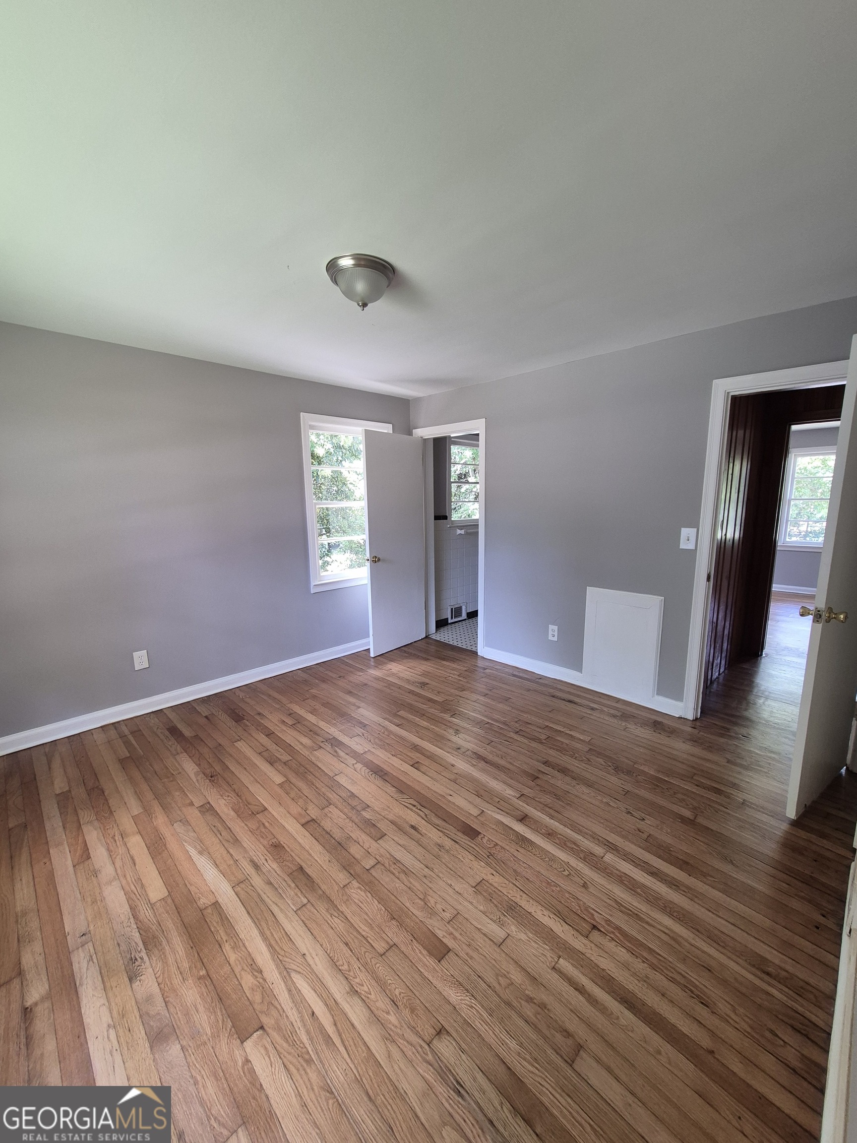 1908 Garrard Street Columbus, GA 31906 - Photo 10 of 14 a view of empty room with wooden floor and window