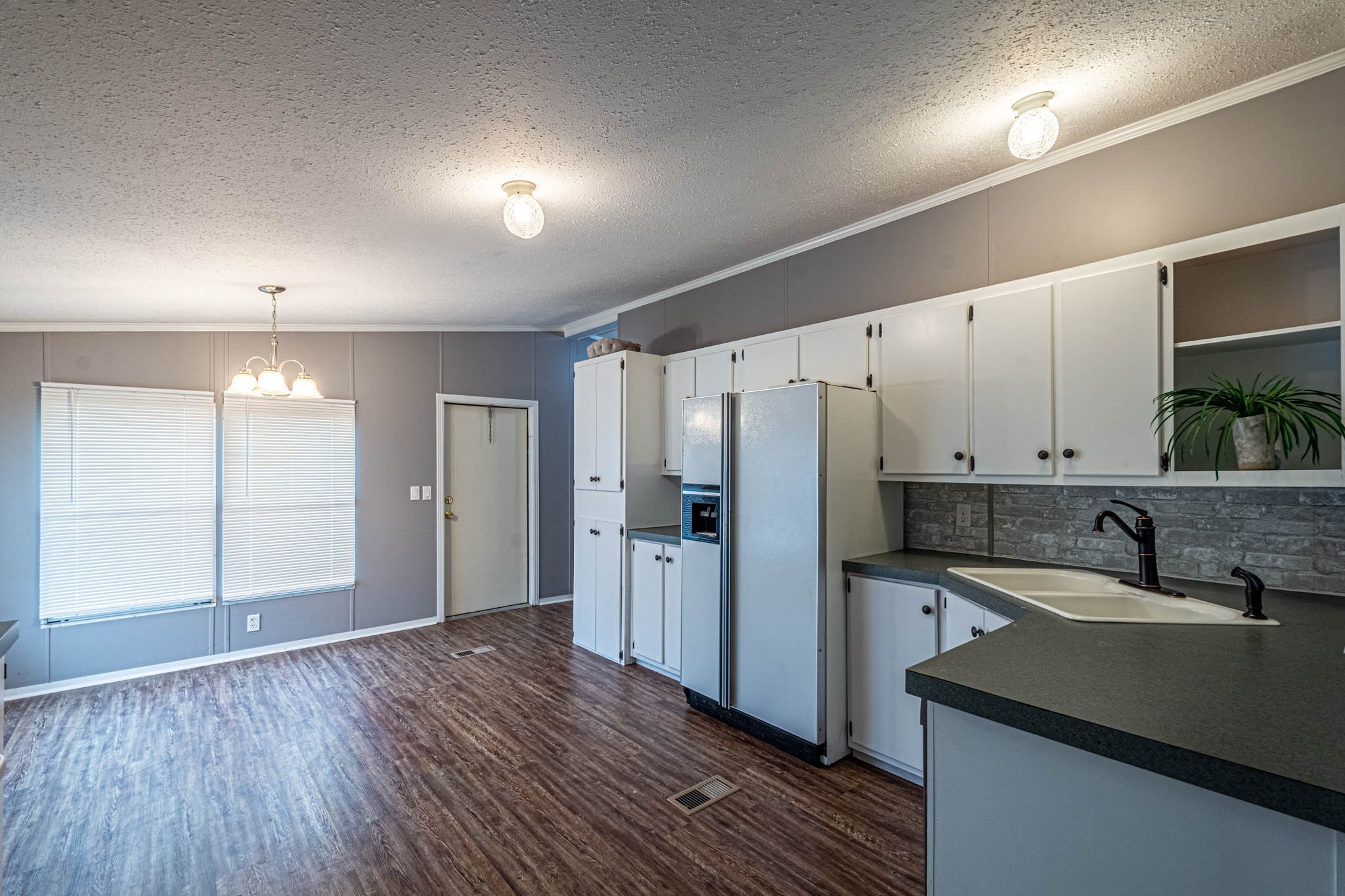 3375 Salem Road Minor Hill, TN 38473 - Photo 13 of 42 a kitchen with a sink a refrigerator and cabinets