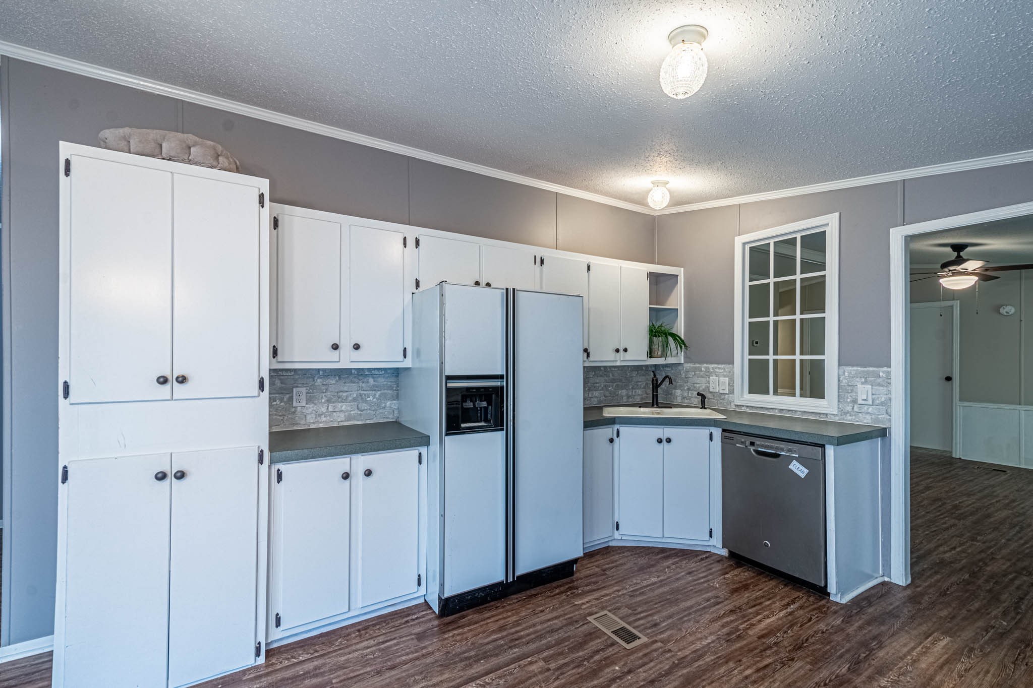 3375 Salem Road Minor Hill, TN 38473 - Photo 16 of 42 a kitchen with stainless steel appliances a refrigerator sink and cabinets