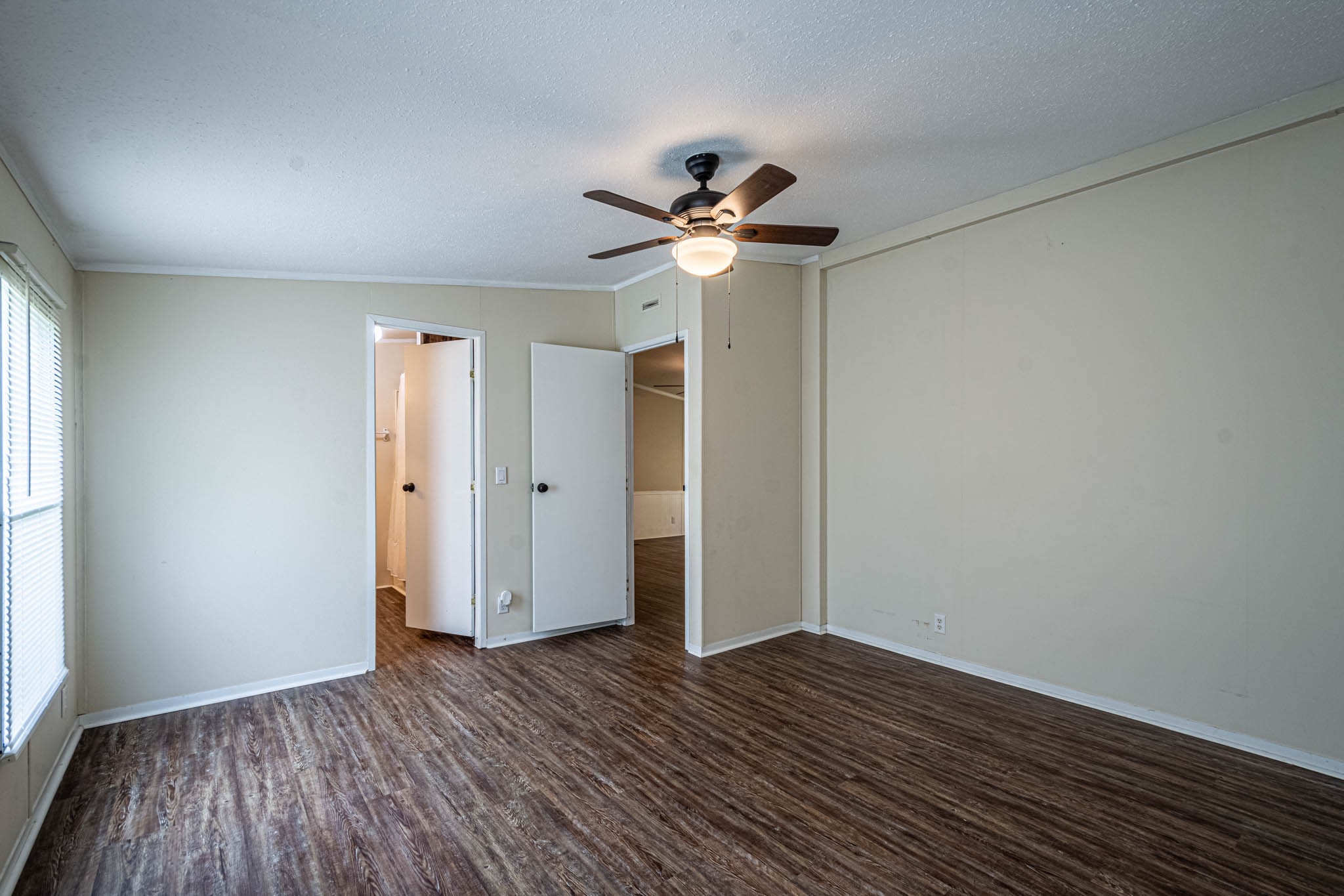3375 Salem Road Minor Hill, TN 38473 - Photo 20 of 42 a view of a room with wooden floor and a ceiling fan