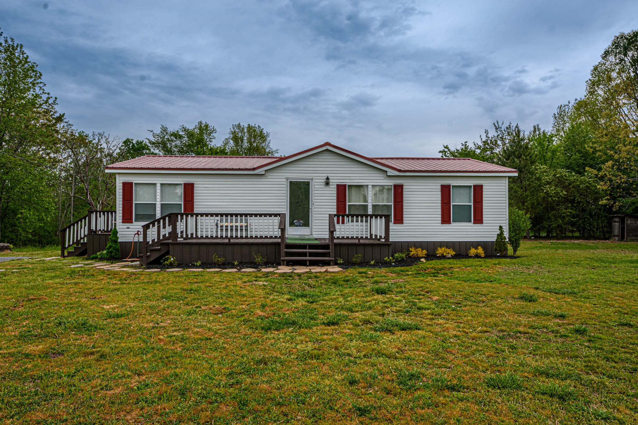 3375 Salem Road Minor Hill, TN 38473 - Photo 2 of 42 a front view of a house with a garden